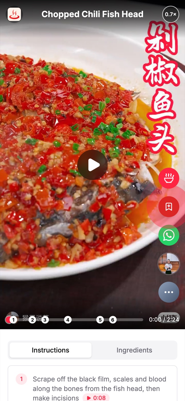 The Cooking Videos player on a phone: a chopped-chili fish head recipe, with numbered step markers along the timeline